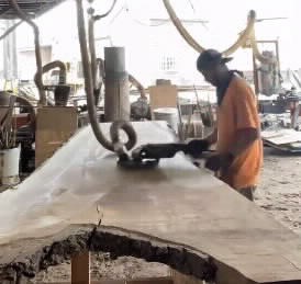 Sanding a wood slab at Berkshire Products
