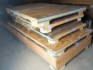 Stack of custom built crates to ship out live edge slabs